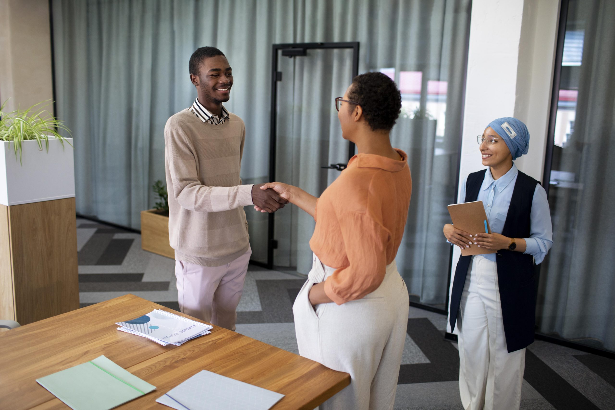 man-introducing-himself-employers-office-job-interview